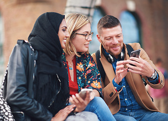 Image showing Friends, diversity and happy people with phone communication and funny meme. Hijab, muslim and talking women and adult learning group and international student community on college steps