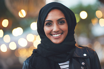 Image showing Mockup, night and portrait of muslim woman in city with bokeh, lights and blurred background. Face, islamic and female relax in Dubai town for fun or explore, happy and smile outside with hijab
