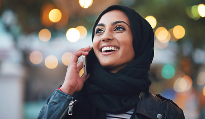 Image showing Muslim, phone call and woman talking in city, chatting or speaking to contact in Dubai. Night bokeh, thinking or happy Islamic girl on 5g mobile smartphone for networking or conversation with hijab