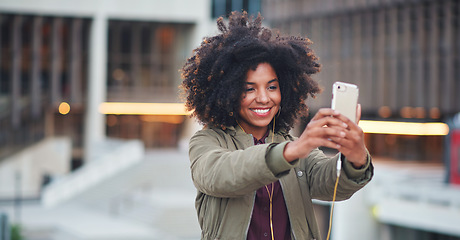 Image showing Black woman, city and selfie with afro, phone or smile for social media profile picture. Happy gen z girl, influencer or smartphone for blog, post or networking app on rooftop balcony for travel