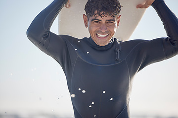 Image showing Portrait, vacation and man holding surfboard at the beach, sea or ocean with a smile and is happy on a summer day. Man, surfing and male surfer with swimsuit in Australia with freedom on the waves