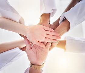 Image showing Healthcare, support and below hands of doctors for motivation, partnership and medicine success. Teamwork, trust and community of medical workers for solidarity, mission and collaboration goals