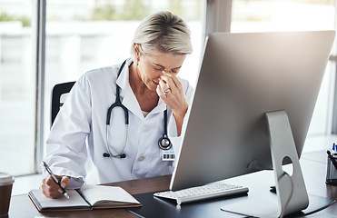 Image showing Healthcare, doctor and woman with headache, stress and depression in office, burnout and overworked. Female employee, consultant tired or senior medical professional in workplace, computer or anxiety