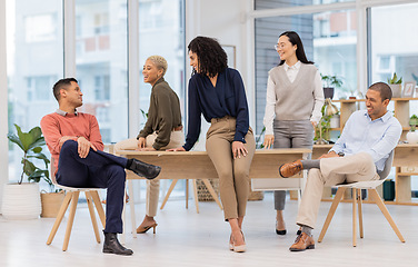 Image showing Friends, relax or funny business people in meeting in startup or group joke on a break in office together. Team building, smile or happy employees laughing in conversation while talking or speaking