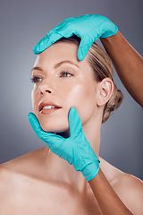 Image showing Woman, studio and hands for plastic surgery, cosmetic transformation and beauty by gray background. Patient, anti aging consultation for collagen, skincare and aesthetic on face for change at clinic