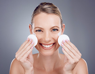 Image showing Skincare, cotton pad and portrait of woman on gray background for wellness, cosmetics and facial treatment. Beauty, dermatology and happy girl with patches for makeup removal, hygiene and cleaning