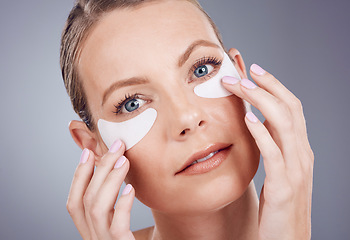 Image showing Skincare mask, eyes and portrait of woman on gray background for wellness, cosmetics and facial treatment. Health, dermatology and face of girl with patches for anti aging, makeup and beauty products
