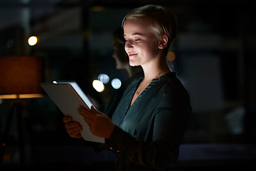 Image showing Work, overtime and woman with tablet, smile and internet search, working late on digital design project. Dark night at office, designer at in creative startup reading online market research report.