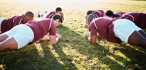 Image showing Man, team and plank on grass field for sports training, fitness and collaboration in the outdoors. Group of sport rugby players in warm up exercise together for teamwork preparation, match or game