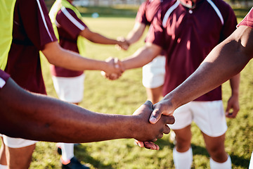 Image showing Man, sports and handshake for team introduction, greeting or sportsmanship on the grass field outdoors. Sport men shaking hands before match or game for competition, training or workout exercise