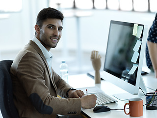 Image showing Writing, smile and face of businessman at computer in office for web design, analytics and planning. Schedule, technology and internet with employee in digital agency for idea, advertising and agenda