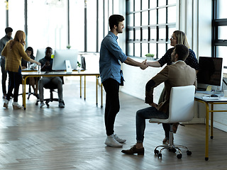 Image showing Greeting, meeting and business people handshake in an office or workplace as agreement on partnership. Team, teamwork and startup colleagues collaborate and welcome a deal or employee to strategy