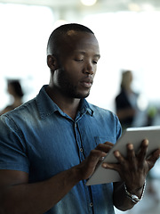 Image showing Technology, business and black man with tablet reading email, sales or social media on web. Research, leadership and company ceo networking with online communication in management at startup office.