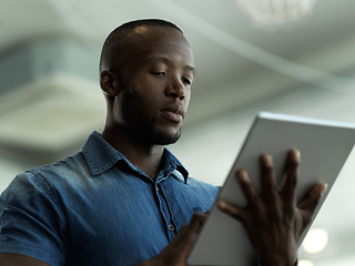 Image showing Technology, communication and black man with tablet reading email, sales news or global networking. Research, company leader with vision and online administration in b2b management at startup office.