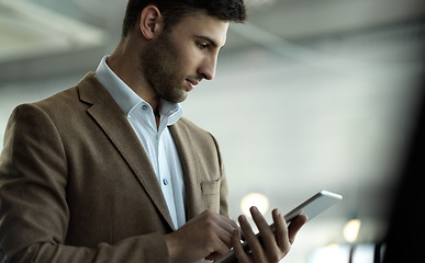 Image showing Technology, internet and Indian businessman with tablet reading email, sales report or website. Research, leadership and company ceo networking with online communication management at startup office.