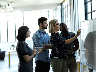 Image showing Creative people, whiteboard and planning strategy in brainstorming, schedule or tasks at office. Group of employee workers in teamwork, collaboration or project management for corporate startup