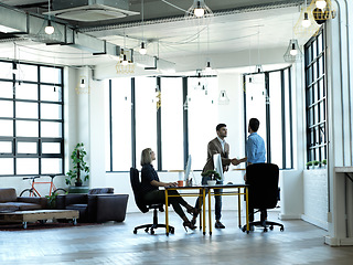 Image showing Business meeting, handshake and accounting company collaboration at workplace for finance deal, b2b work partnership and working accountants with thank you hand gesture for crm contract discussion