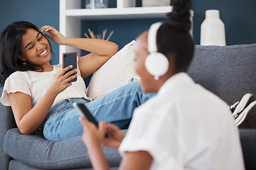 Image showing Happy, relax and friends relax in living room, bond and enjoy streaming service in their apartment. Day off, chilling and women having fun indoors in their home, reading meme, social media or app