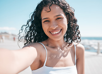 Image showing Beach selfie, black woman portrait and social media influencer streaming on app. Travel content creator, young person and sea smile of a happy female in Miami taking a profile picture on vacation