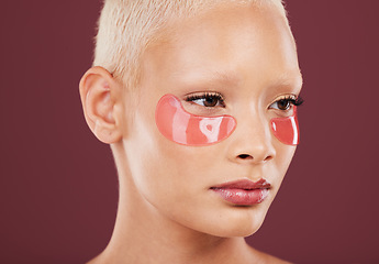 Image showing Eye patches, skincare and cosmetics of black woman doing face cleaning and wellness facial. Beauty, skin glow and mockup of a young model in a studio for dermatology, collagen and self care treatment