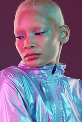 Image showing Beauty, cyberpunk and high fashion black woman with unique style, makeup and hairstyle isolated in a studio neon background. Creative, artistic and bright and colorful female is trendy and stylish