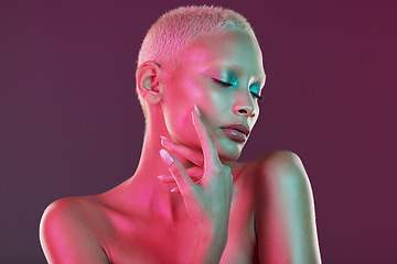 Image showing Neon, skincare and beauty, woman with hand in face, makeup and light in creative advertising on studio background. Cyberpunk, art girl and fantasy model isolated in futuristic skin care mockup space