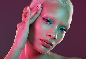 Image showing Skincare, beauty and cyberpunk, portrait of woman with neon makeup and lights for creative advertising on studio background. Art girl, cosmetics and model isolated for futuristic face mockup