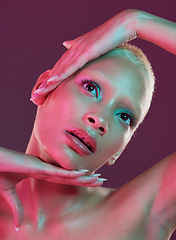 Image showing Creative, beauty and art, woman with neon makeup and lights for skincare advertising on studio background. Cyberpunk face, fantasy and model isolated for skin care and futuristic mock up space.