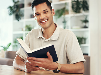 Image showing Portrait, man and reading book to relax, hobby and happiness in living room, peace and literature. Face, male and gentleman with novel, journal and knowledge in lounge, smile and cheerful in home