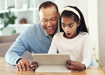 Image showing Digital tablet, shock and girl with her father streaming a movie or video online for entertainment. Surprise, technology and child watching a film or show with her dad on mobile device at their home.