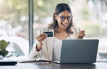 Image showing Finance, credit card and winner with woman and laptop in office for savings, investment or online shopping sale. Success, fintech and ecommerce with customer and website for deal, payment or offer