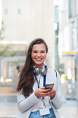 Image showing Phone, happy and portrait of a woman in the city walking to her office while networking online. Happiness, smile and female browsing on social media, mobile app or internet while commuting to work.