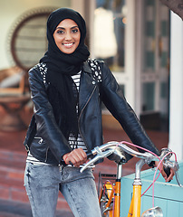 Image showing Muslim, woman and city portrait with bike for eco friendly transport, travel and smile with excited face. Happy islamic girl, gen z student and bicycle transportation with sustainability in metro