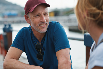 Image showing Man, woman and harbor with happy conversation on travel, vacation or date by ocean in summer sunshine. Senior couple, talk and listening with care, romantic bonding or love by sea for outdoor holiday