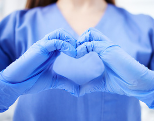 Image showing Woman, doctor and hands in heart emoji for healthcare, life insurance or sign on mockup at hospital. Hand of medical female expert GP showing love, hearty symbol or gesture for medicare assurance