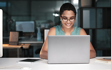 Image showing Office laptop, happy woman and night work on overtime article for social media app, digital website or online blog. Employee inspiration, reading internet info and African journalist typing news post