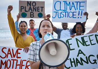 Image showing Climate change protest, megaphone and Asian woman with crowd at beach protesting for environment, global warming and to stop pollution. Save the earth, portrait and female leader shouting on bullhorn