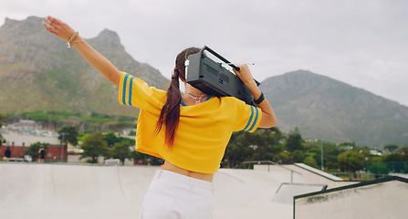 Image showing Radio, dance and woman with a boombox in the city listening to music, moving and having fun. Freedom, hip hop and female dancing with energy to a song, album or playlist on a speaker in a urban town.