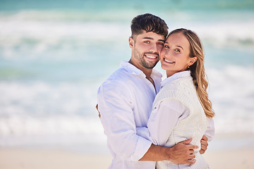 Image showing Portrait, love or couple hug at beach on holiday vacation or romantic honeymoon to celebrate marriage commitment. Travel, trust or woman bonding or hugging a happy partner in fun summer romance