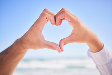 Image showing Love, hands or couple at beach with heart sign on holiday vacation or romantic honeymoon to celebrate marriage Commitment, trust or lovers showing hearty shape emoji or icon in fun summer romance