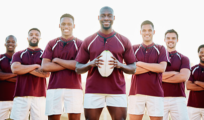 Image showing Rugby, field and portrait of team with ball and smile standing together with confidence in winning game. Diversity, black man and group of strong sports men in leadership, fitness and happy teamwork.