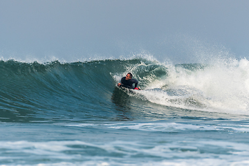 Image showing Bodyboarder surfing ocean wave