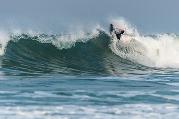 Image showing Bodyboarder surfing ocean wave