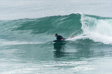 Image showing Bodyboarder surfing ocean wave