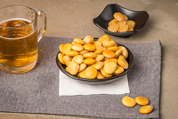 Image showing Tasty lupins and glass of beer