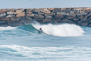 Image showing Bodyboarder surfing ocean wave