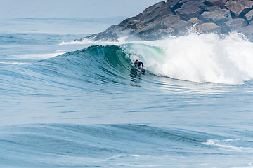 Image showing Bodyboarder surfing ocean wave