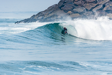 Image showing Bodyboarder surfing ocean wave