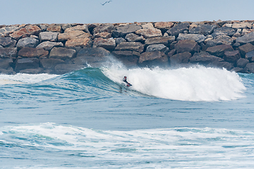 Image showing Bodyboarder surfing ocean wave