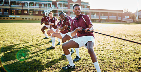 Image showing Man, team and sports tug of war with rope for fitness exercise, strength challenge or competition on field. Sport men in rivalry, teamwork struggle or leadership pulling ropes in training activity